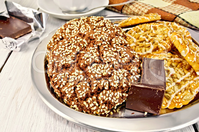 Cookies chocolate and shortbread with sesame on metal tray