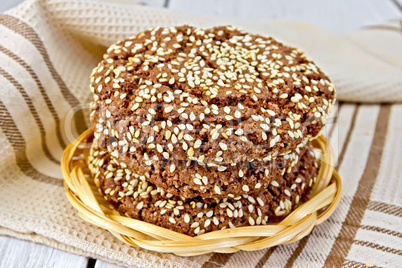 Cookies chocolate in wicker plate on board