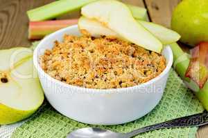 Crumble with pears and rhubarb on board