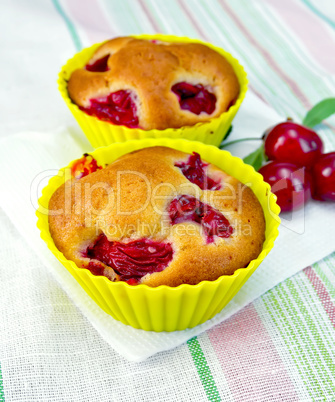 Cupcakes with cherries on napkin
