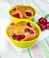 Cupcakes with cherries on napkin