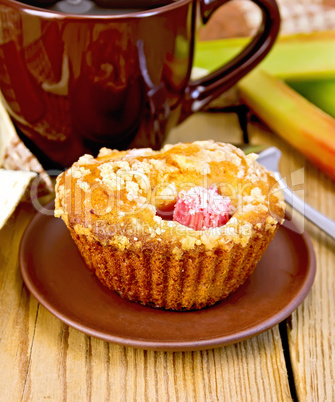 Cupcakes with rhubarb and mug on board