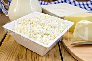 Curd with cheese and sour cream on board