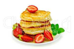 Flapjacks with strawberries and mint in plate