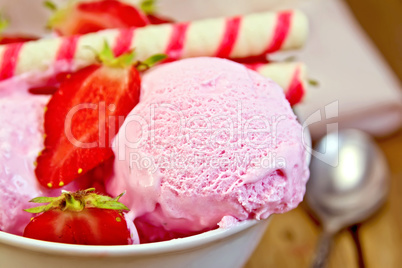 Ice cream strawberry in bowl with waffles on board