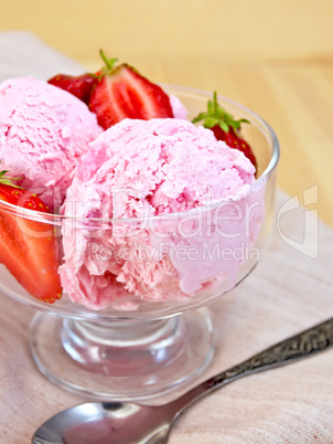 Ice cream strawberry in glass goblet on napkin