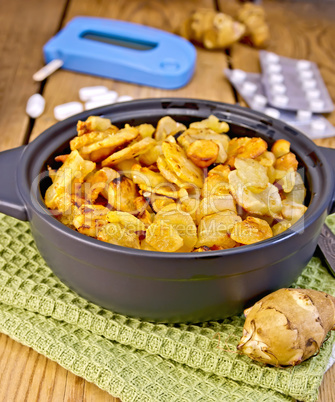 Jerusalem artichokes roasted in pan with meter and pills