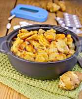 Jerusalem artichokes roasted in pan with meter and pills