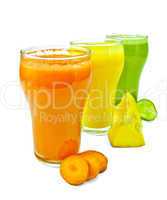 Juice vegetable in three glasses with vegetables in row