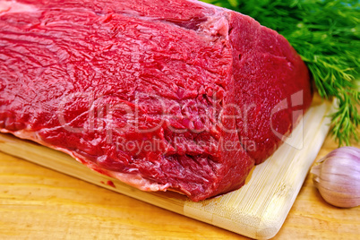 Meat beef whole piece on wooden board