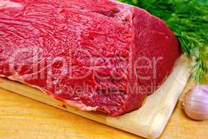 Meat beef whole piece on wooden board