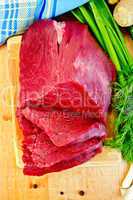 Meat beef with ginger on wooden board