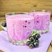 Milkshake with black currants on napkin