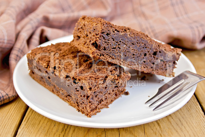 Pie chocolate in plate on board