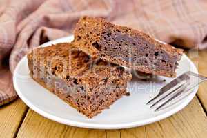 Pie chocolate in plate on board