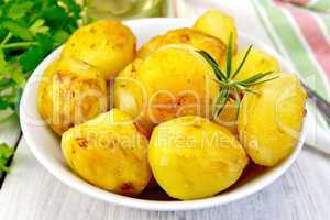 Potatoes fried in plate on light board