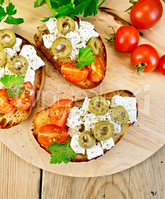 Sandwich with feta and olives on table