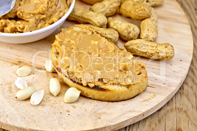 Sandwich with peanut butter and nuts on board