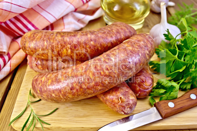 Sausages beef on board with knife