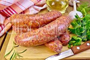 Sausages beef on board with knife