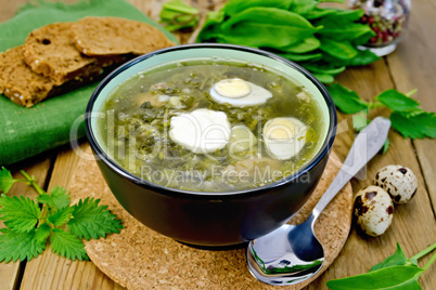Soup green of sorrel and nettle with quail eggs