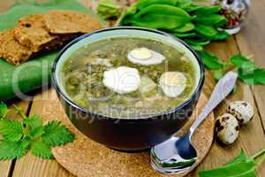 Soup green of sorrel and nettle with quail eggs