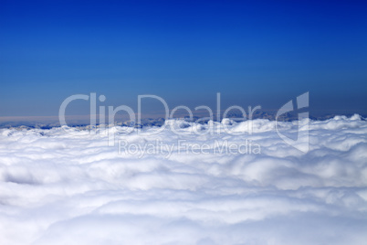 Mountains under clouds in sun day