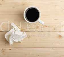 cup of coffee and crumpled paper