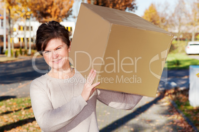 Woman wearing large package on the shoulder