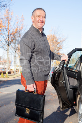 Man standing next to car