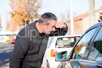 Man standing next to car