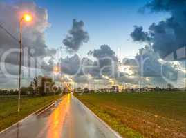 Wet road at sunset - Autumn colors at dusk