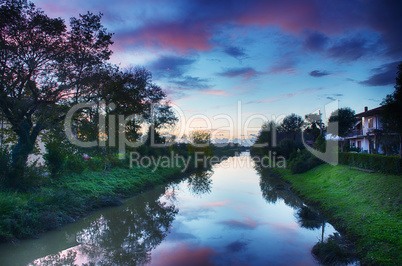 Autumn river reflections at sunset - Tuscany, Italy