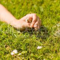 Close up of a pretty redhead holding daisy