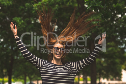 Young woman jumping in the park