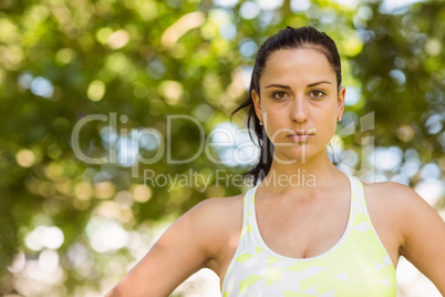 Focused athletic brunette in the park