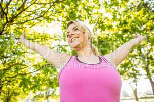 Fit blonde stretching in the park