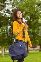 Female college student with bag in park