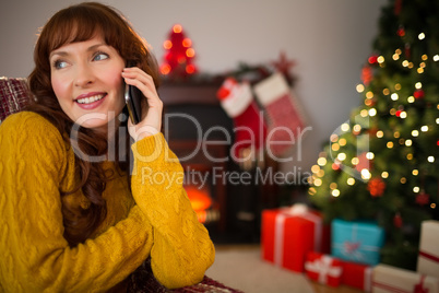 Smiling red air on the phone at christmas
