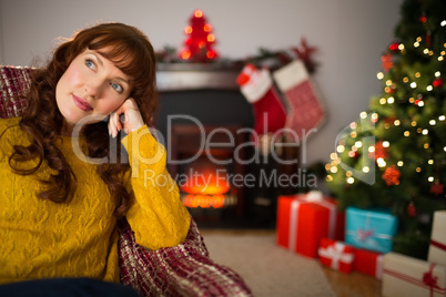 Beauty redhead thinking and relaxing at christmas