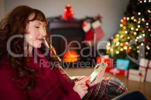 Calm redhead text messaging at christmas