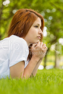 Pretty redhead thinking and lying