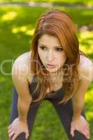 Pretty redhead panting in the park