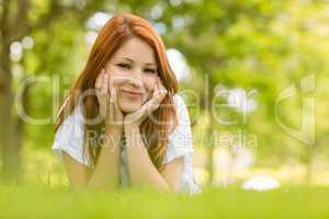 Portrait of a pretty redhead content