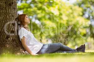 Pretty redhead sitting and thinking