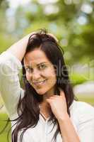 Portrait of a smiling brunette posing