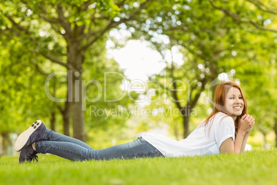 Pretty redhead cheerful and lying