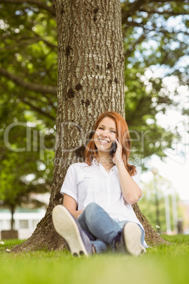 Pretty redhead smiling on the phone