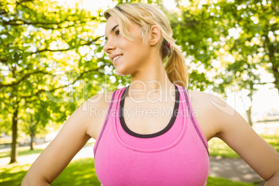 Fit blonde standing in the park