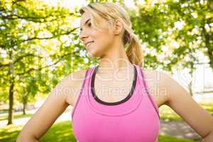 Fit blonde standing in the park